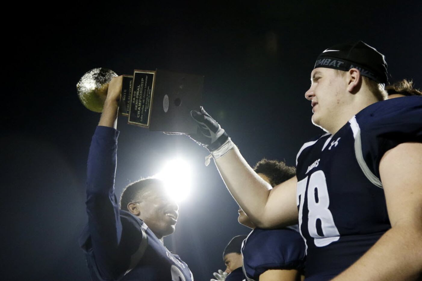 From left, Frisco Lone Star Rangers Kenneth Warner holds up their trophy while Tanner Leser...