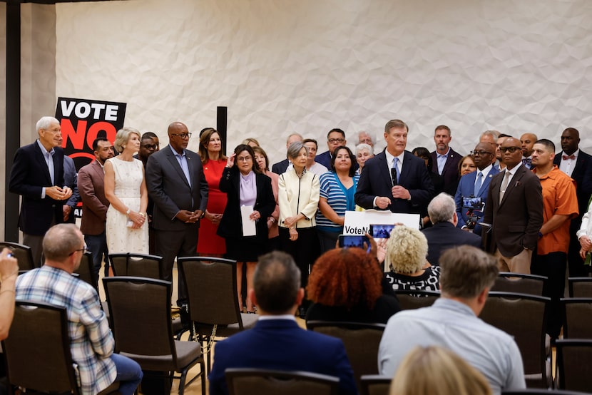 Former Dallas Mayor Mike Rawlings speaks alongside a coalition of current and former Dallas...