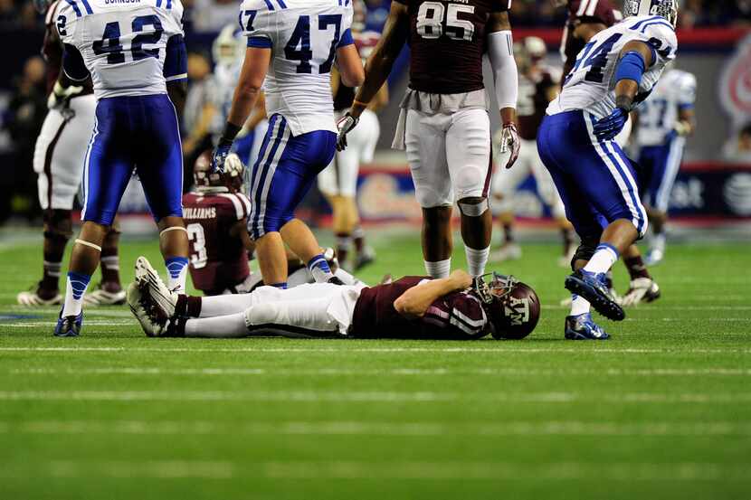 Dec 31, 2013; Atlanta, GA, USA; Texas A&M Aggies quarterback Johnny Manziel (2) lays on the...