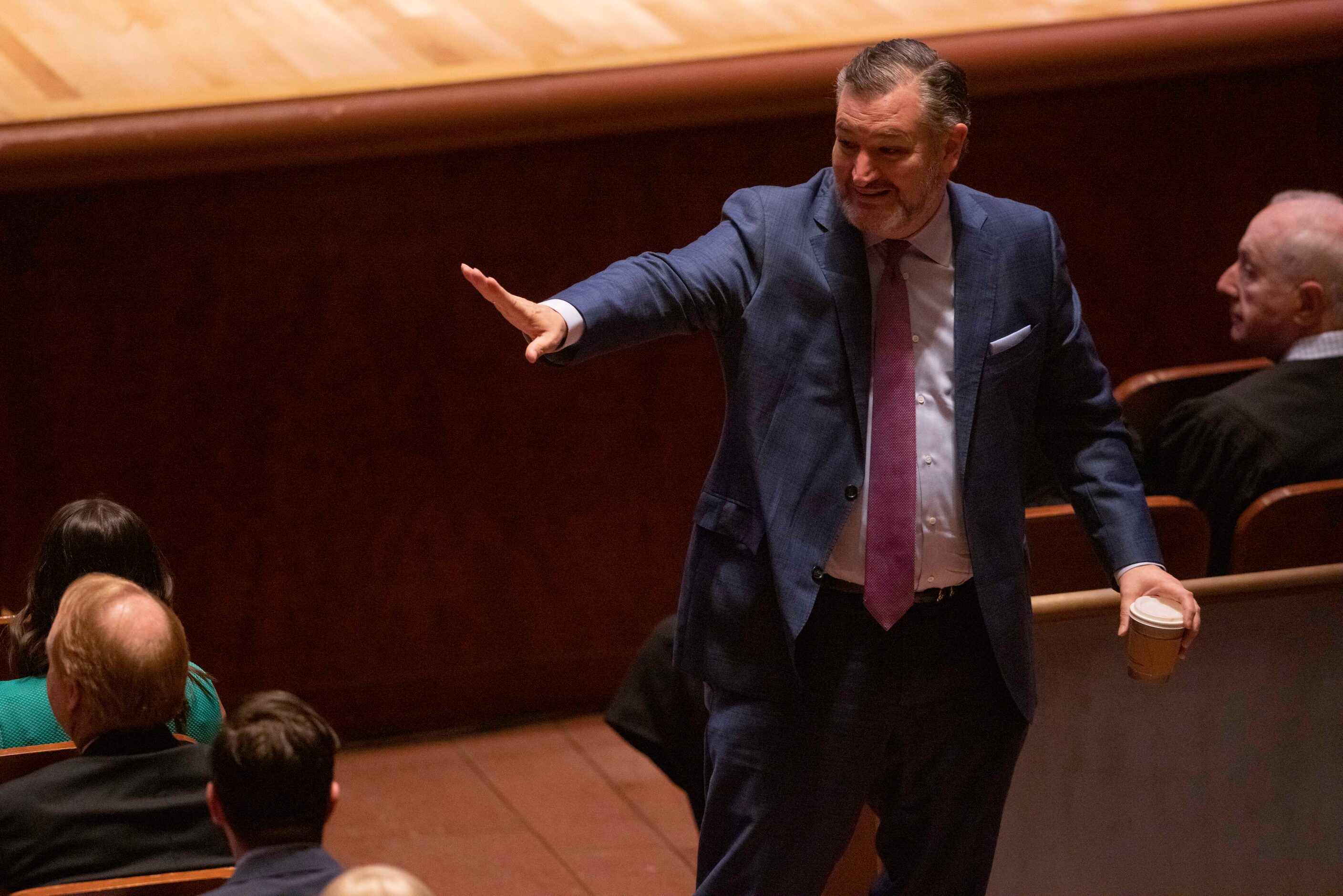 Sen. Ted Cruz waves goodbye while leaving the Dallas City Council’s inauguration ceremony on...