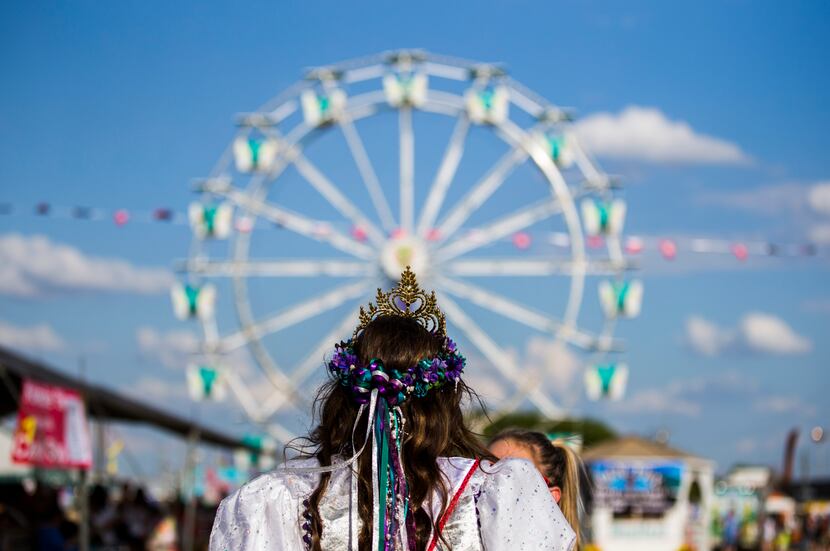 Miss West Fest 2018 Abby Kolar, 18, walks toward a Ferris wheel on the West Fest grounds on...