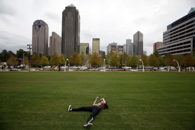 Claire Stuart, 13, relaxed on the great lawn of Klyde Warren Park on Thursday. Her mom, a...