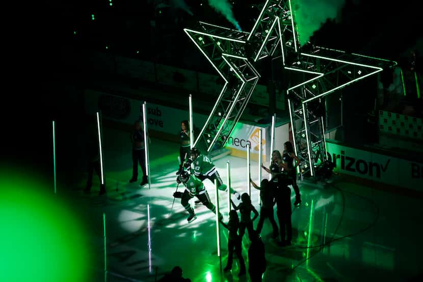 Dallas Stars left wings Jason Robertson (21) and Mason Marchment (27) take the ice to face...