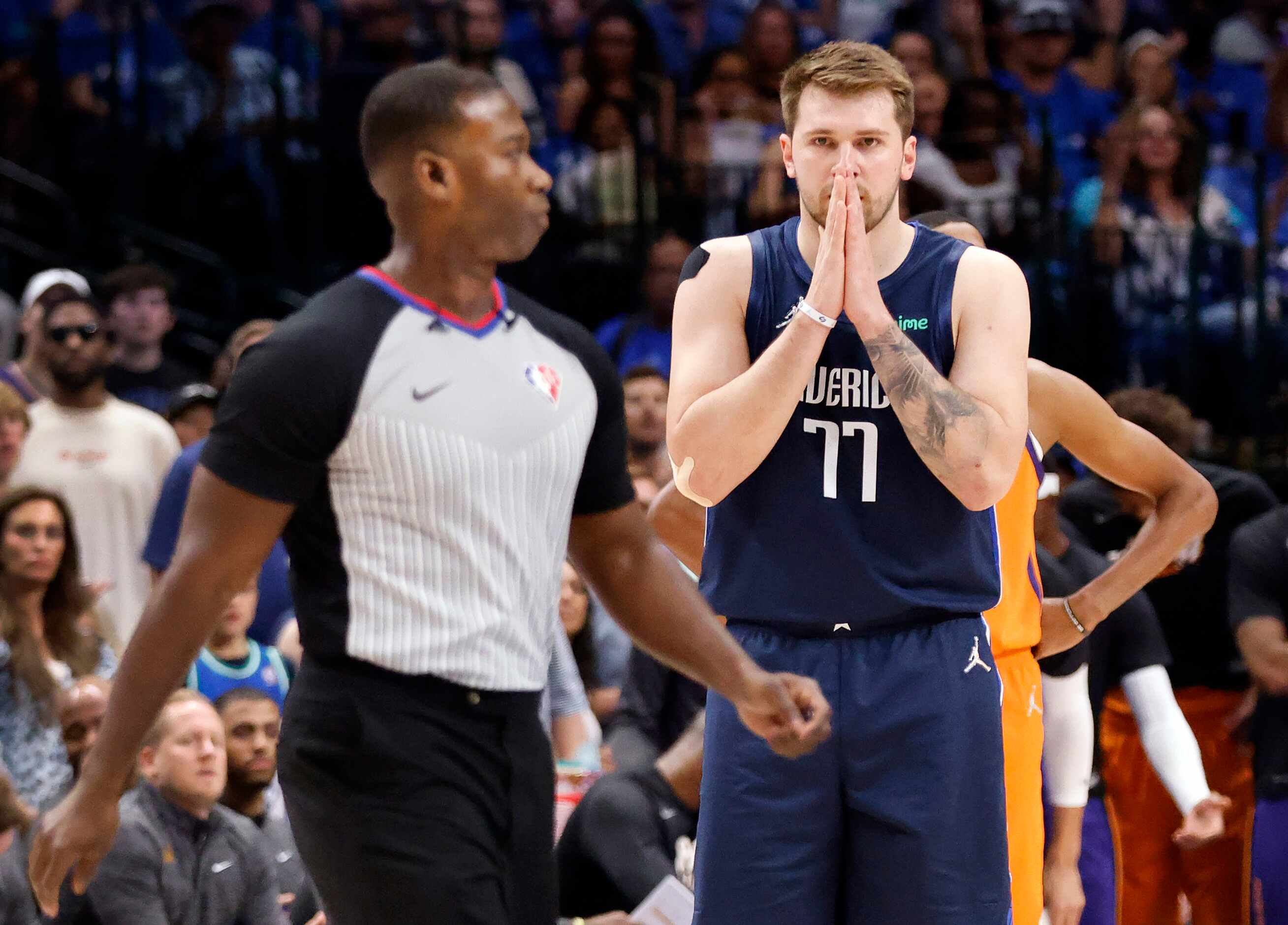 Dallas Mavericks guard Luka Doncic (77) reacts after he was given a first quarter technical...