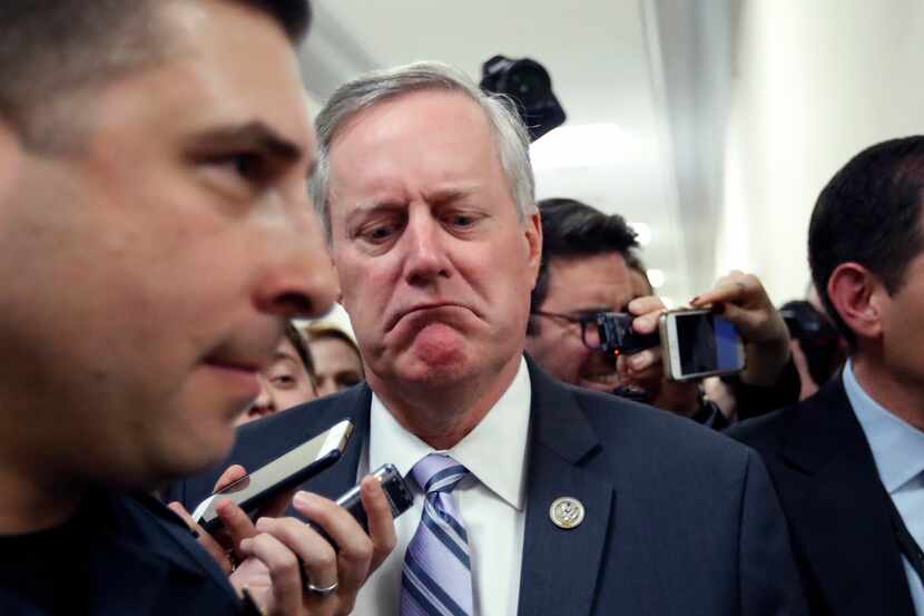 House Freedom Caucus Chairman Rep. Mark Meadows, R-N.C. reacts to a reporters question on...
