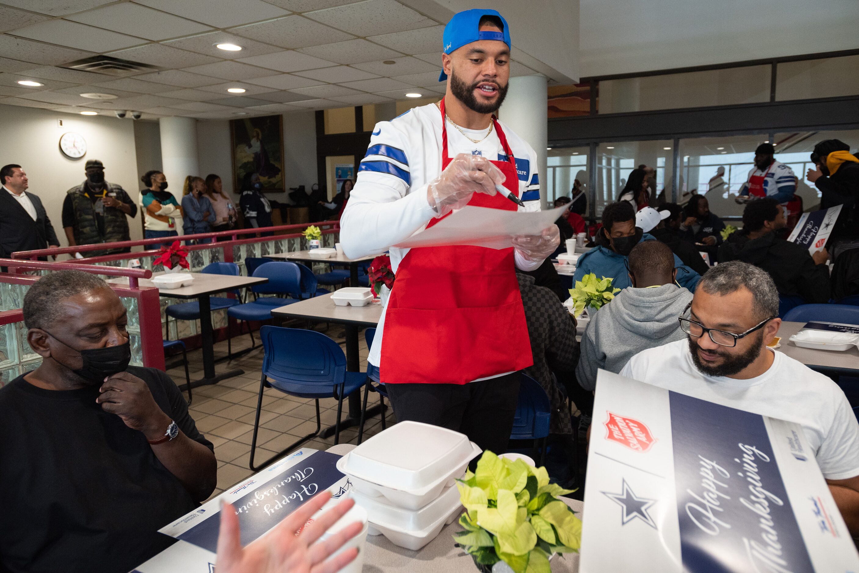 Dallas Cowboys starting quarterback Dak Prescott signs autographs for Steven Donaldson, 63,...