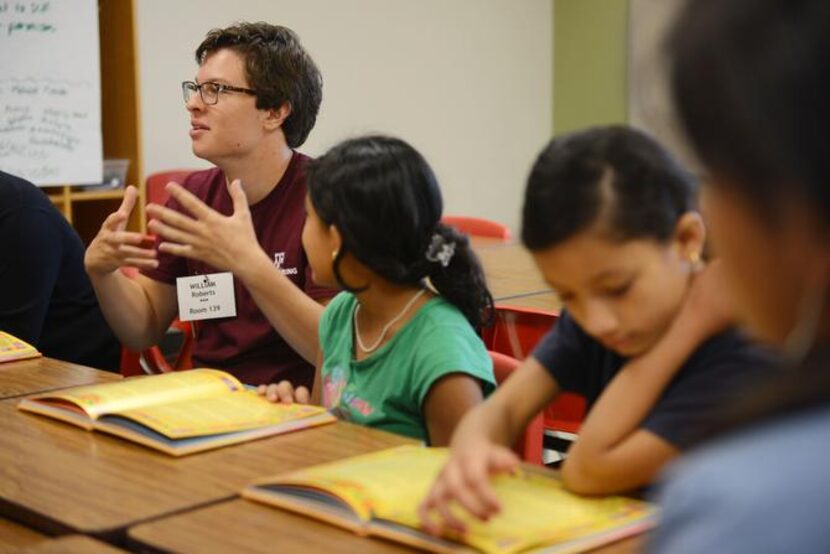 
Volunteer William Roberts begins asking the students a series of discussion questions after...