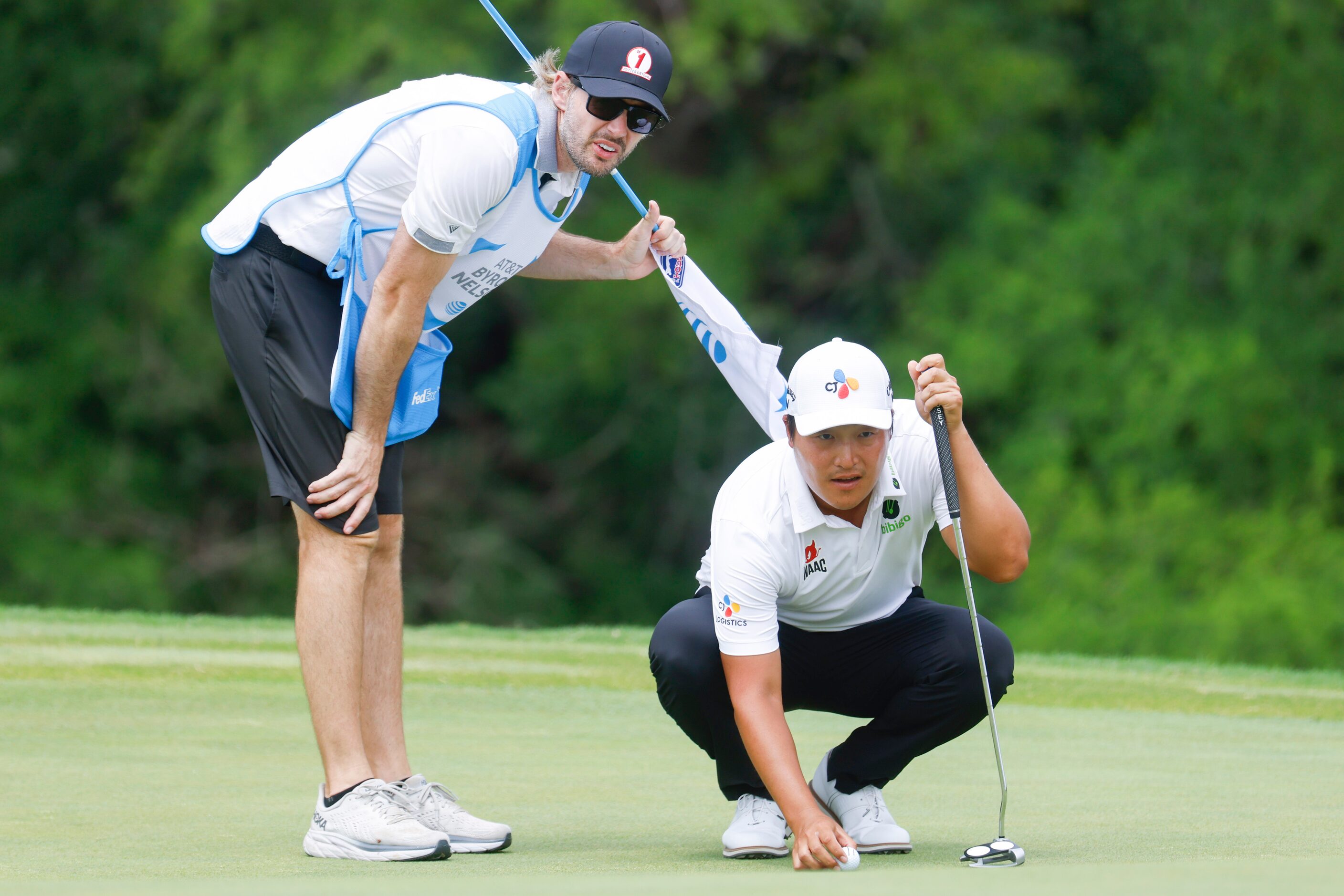 K.H. Lee lines up his putt on the ninth hole during the second round of the AT&T Byron...