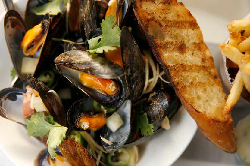 Mussels and fries at Wheelhouse, one of two new restaurants from Headington Cos. in the...