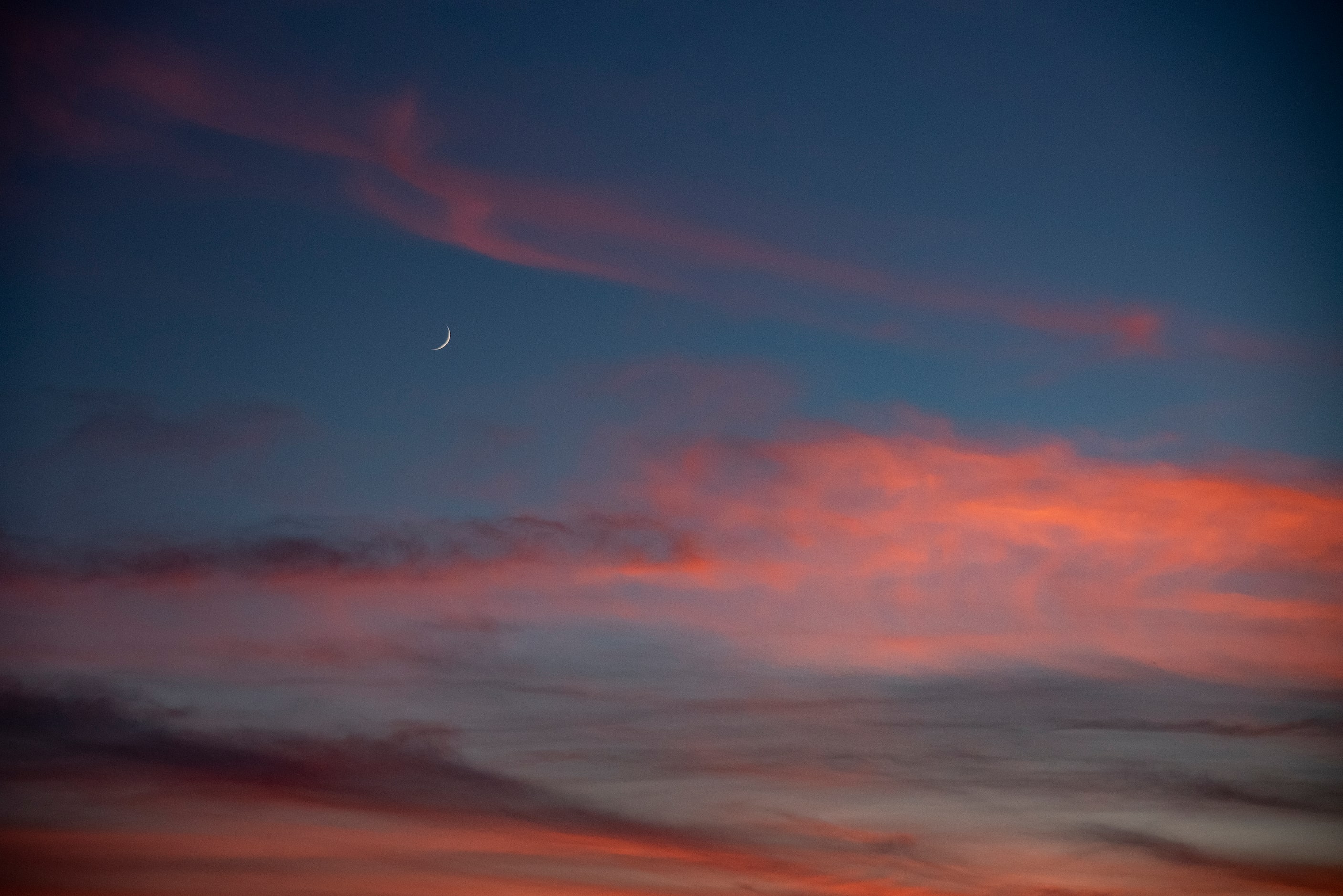 The moon sets with the sun during South Grand PrairieÕs game against Grand Prairie at the...