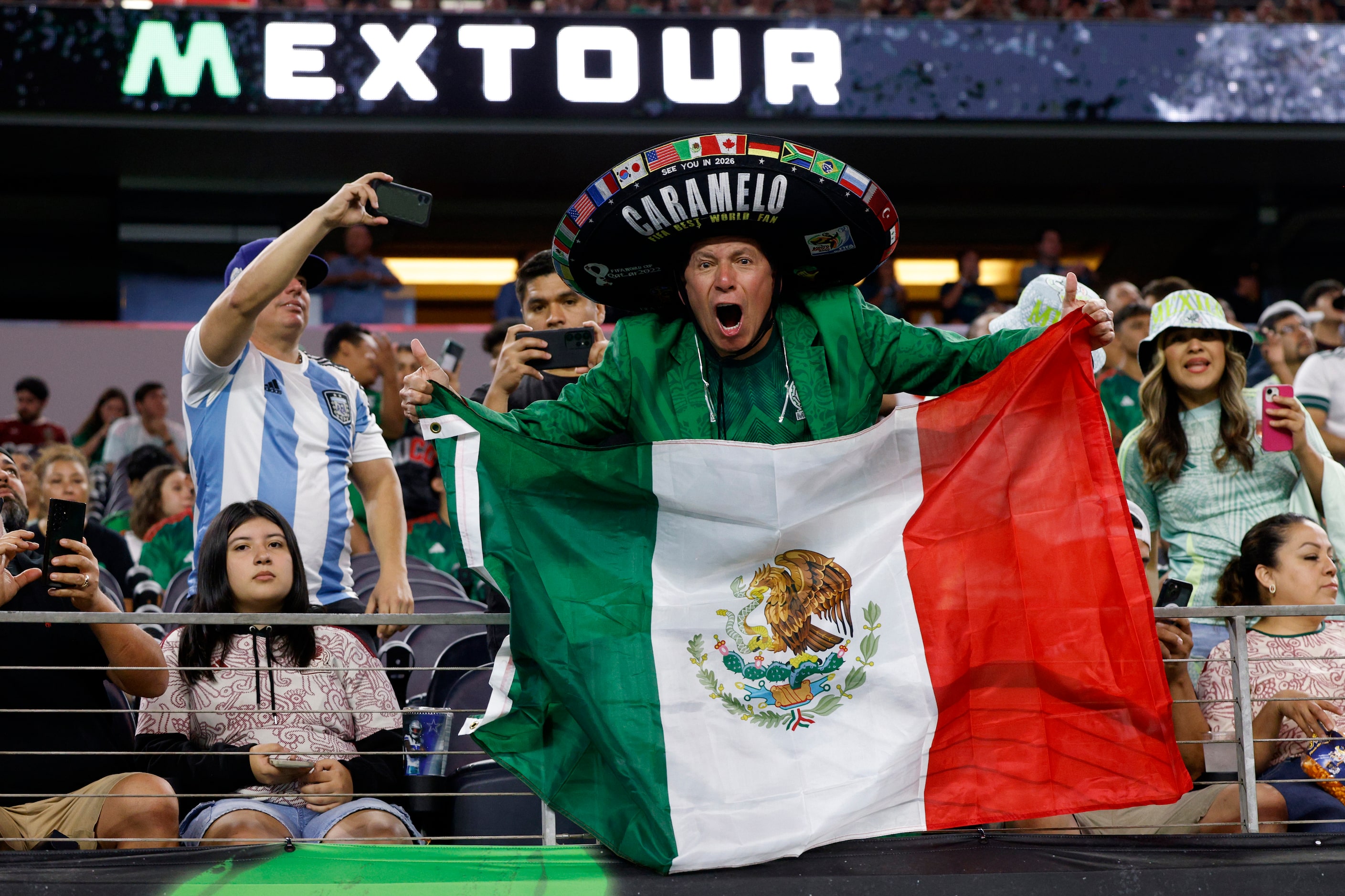 A Mexico fan cheers before the first half of an international friendly match between Mexico...