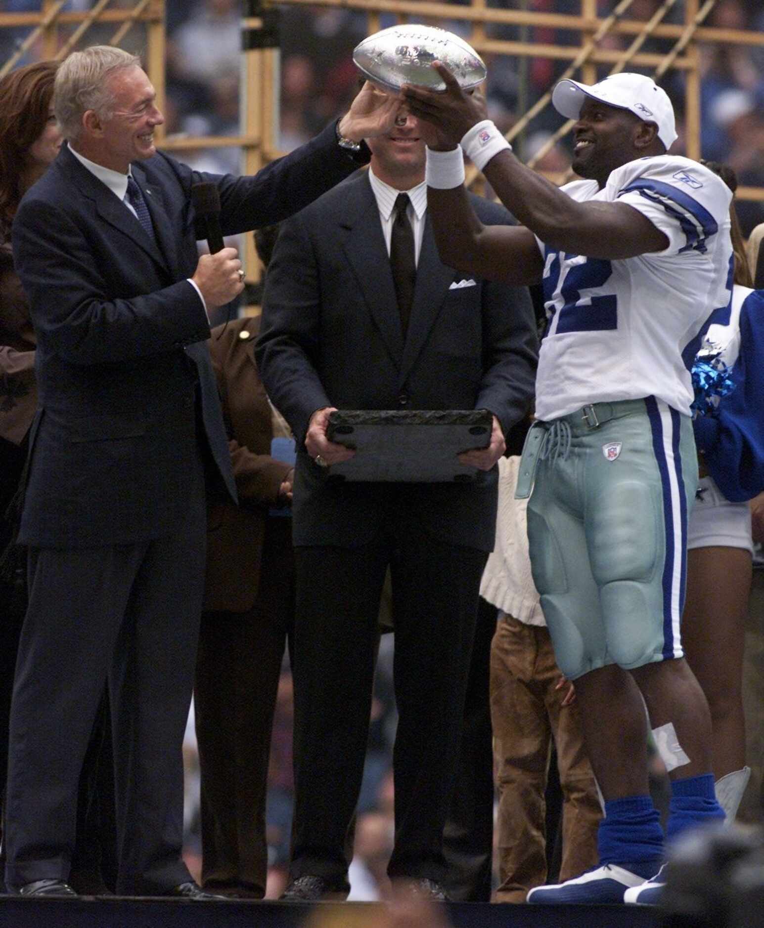 Dallas Cowboys owner Jerry Jones, left, presents running back Emmitt Smith with the NFL...