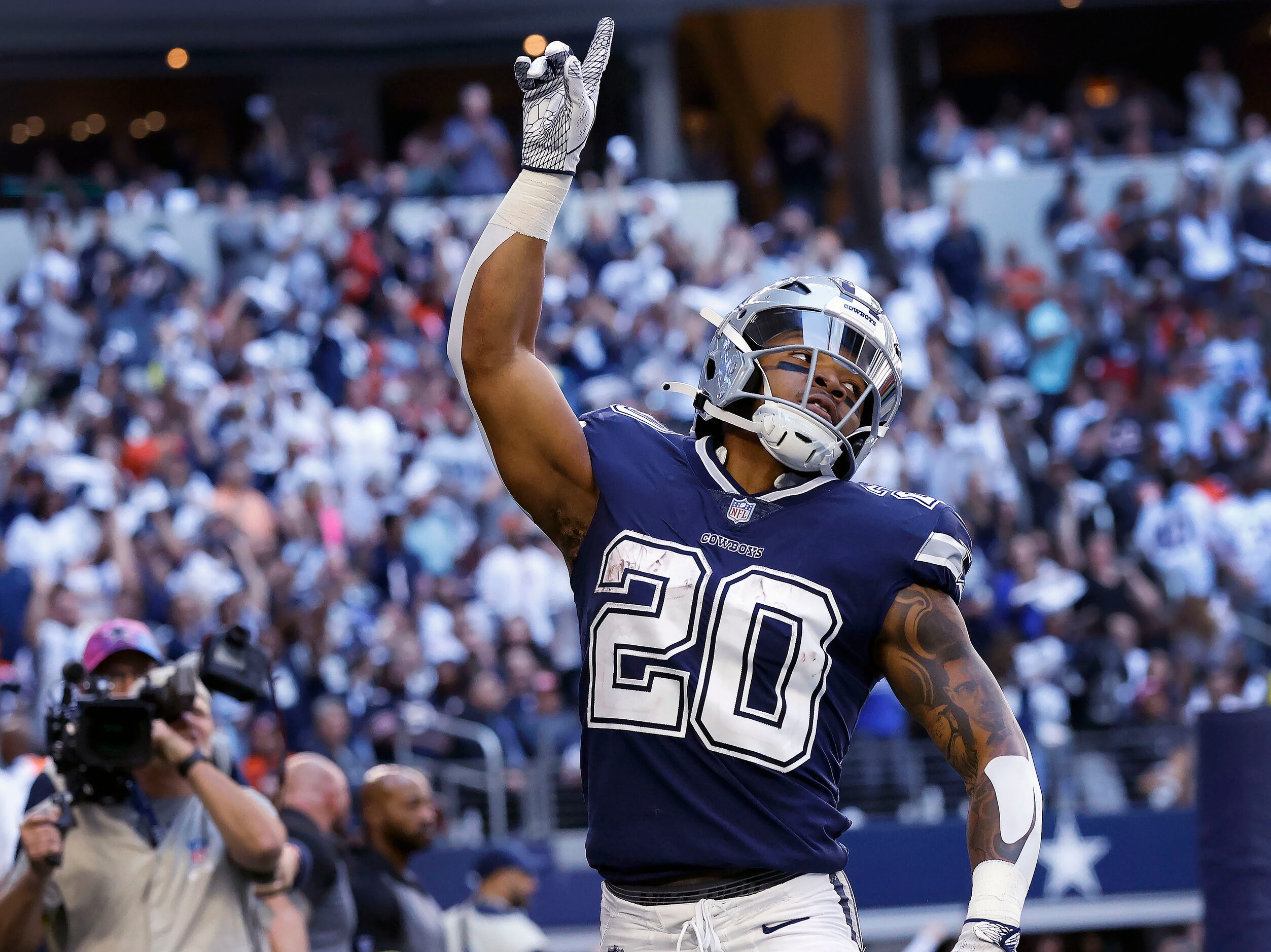 Dallas Cowboys running back Tony Pollard (20) celebrates his second quarter touchdown run...