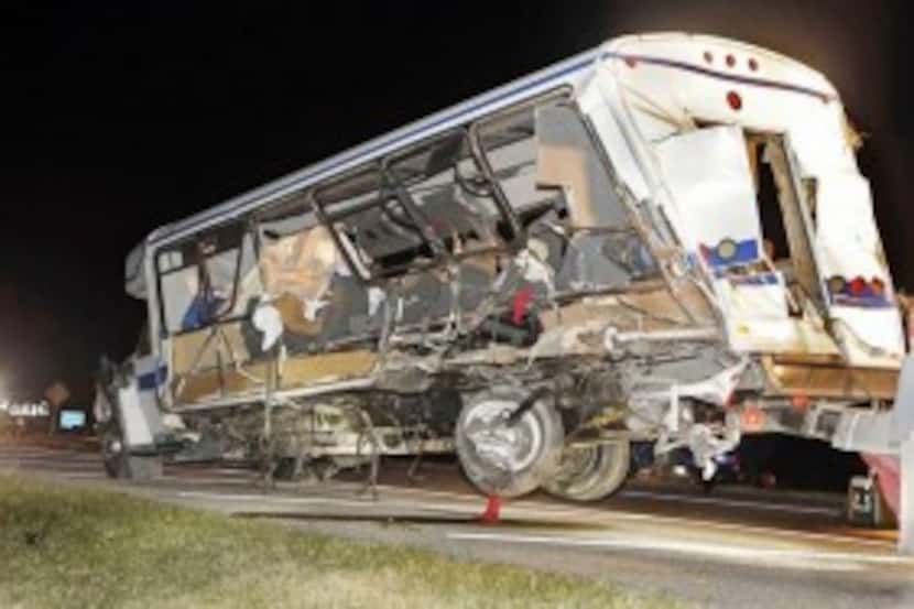  A wrecker removed the North Central Texas College team bus from the accident scene just...