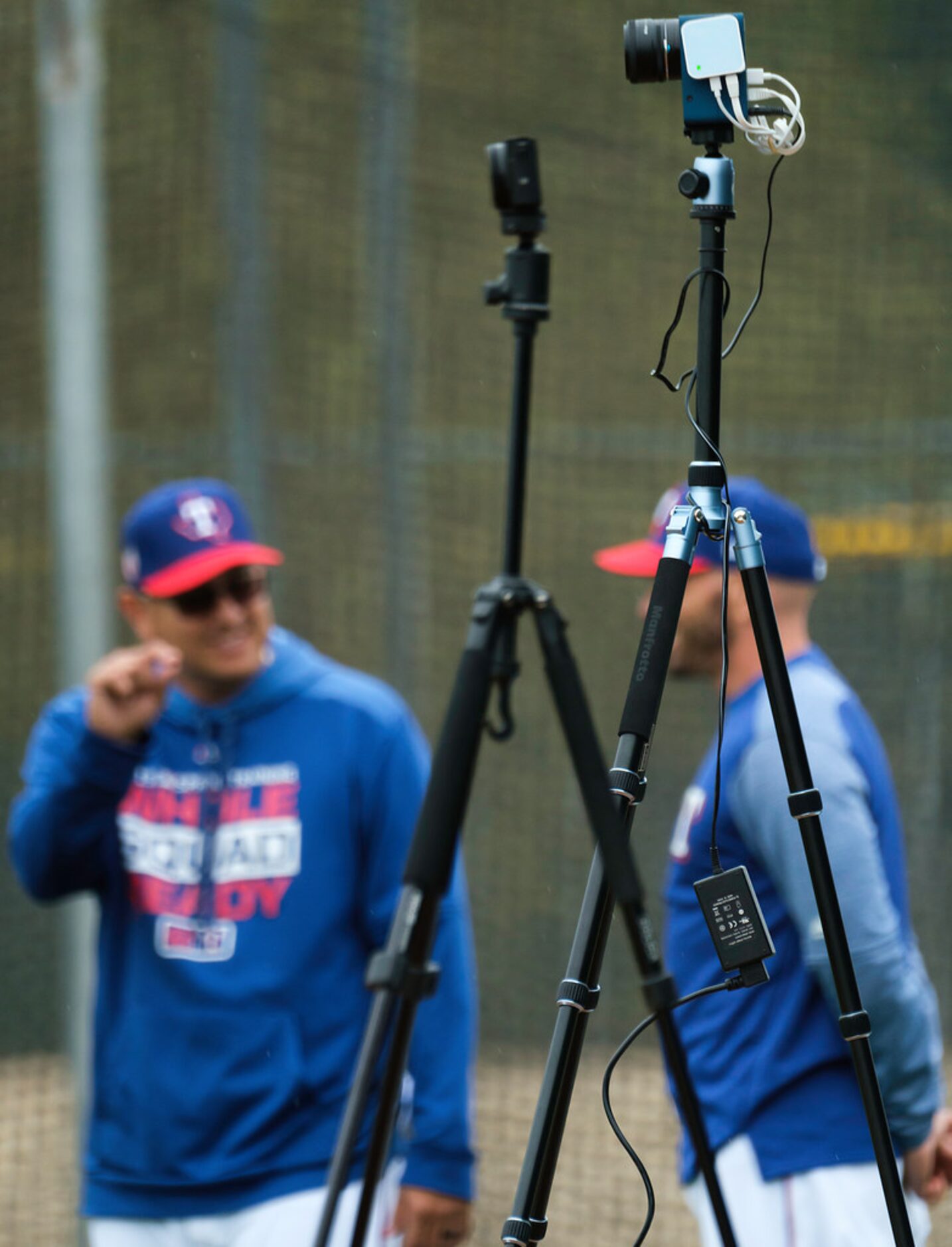 Texas Rangers pitching coach Julio Rangel (left) and manager Chris Woodward talk in the...