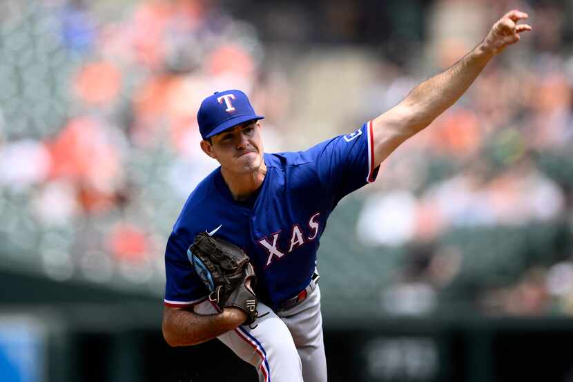Texas Rangers starting pitcher Cody Bradford throws during the first inning of a baseball...