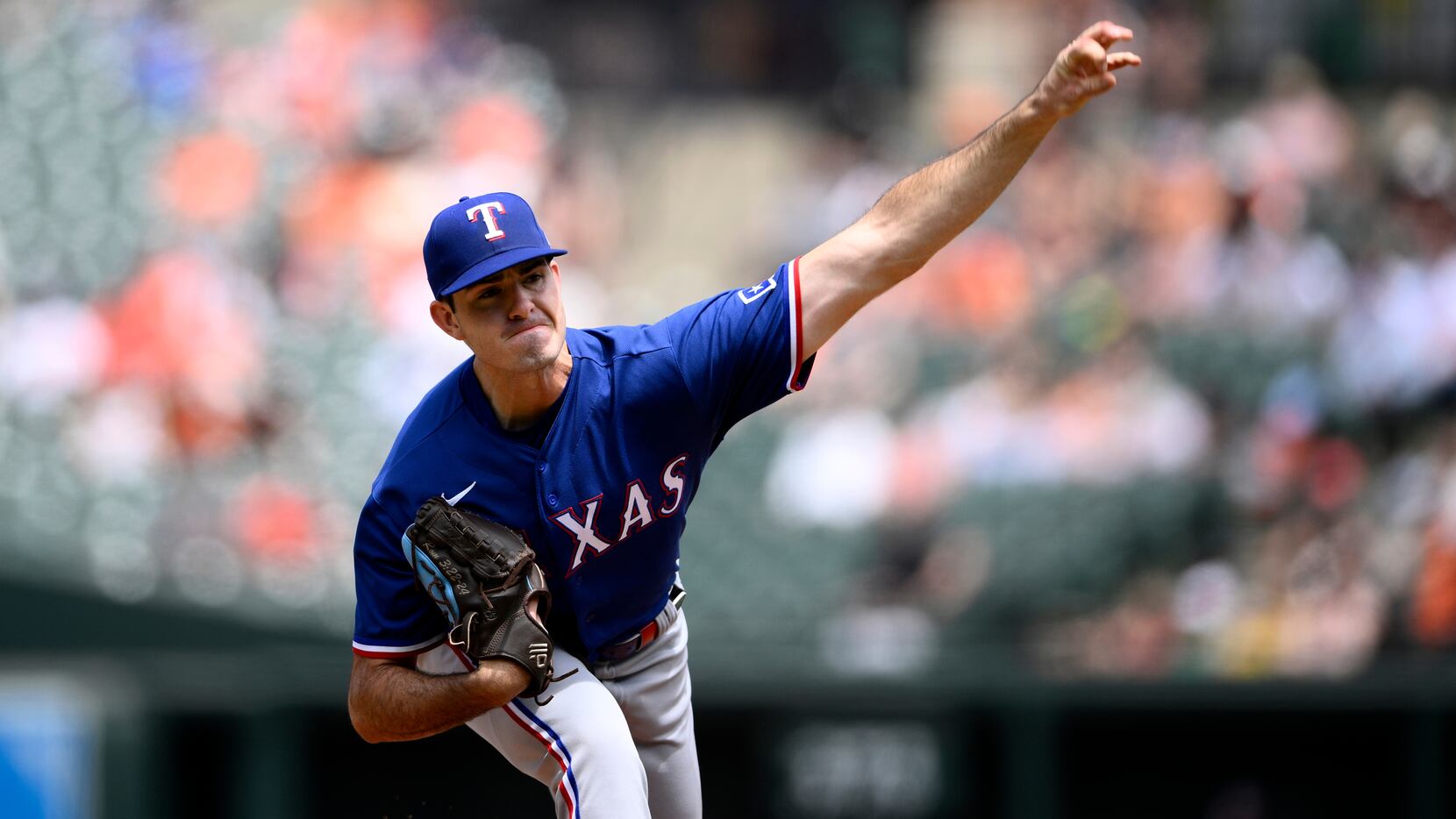Texas Rangers starting pitcher Cody Bradford throws during the first inning of a baseball...