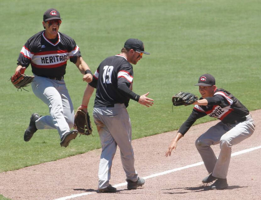 Colleyville Heritage right fielder Jakob Berger (22), left,  leaps in celebration as 2nd...