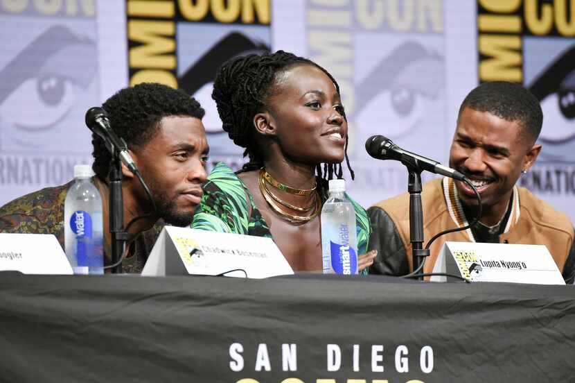 Chadwick Boseman, from left, Lupita Nyong'o, and Michael B. Jordan attend the "Marvel" panel...