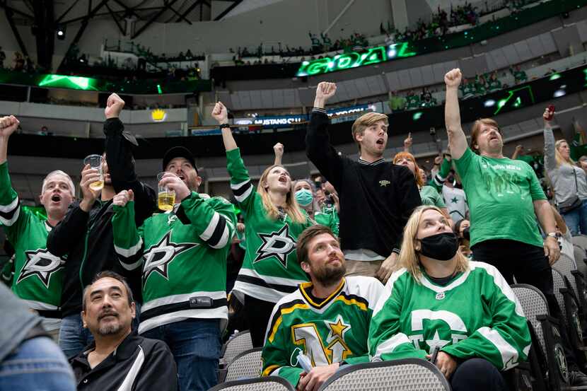 Dallas Stars fans celebrate a goal during the second period of a Dallas Stars preseason game...