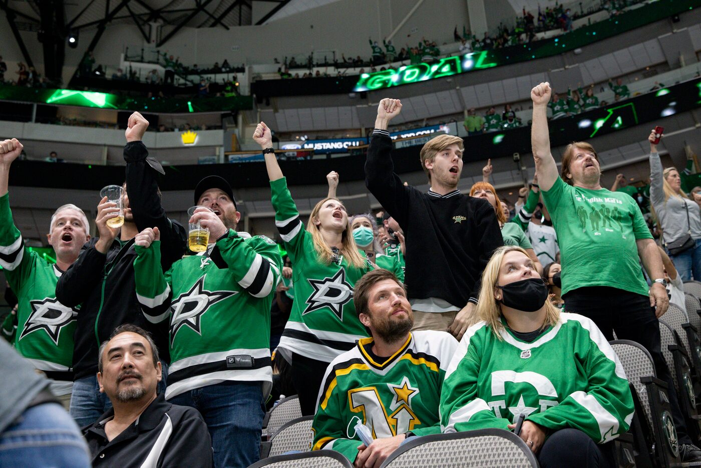 Dallas Stars fans celebrate a goal during the second period of a Dallas Stars preseason game...