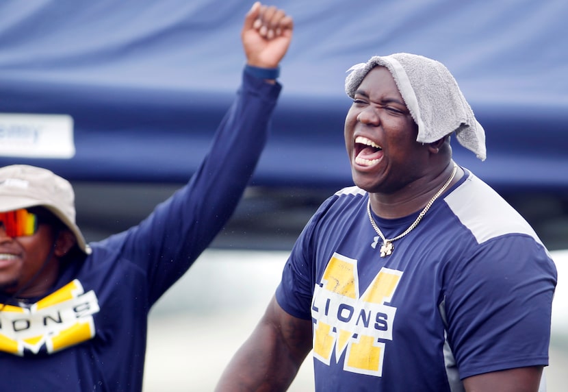 McKinney Lions head coach Marcus Shavers, right, erupts after his team scored during the...