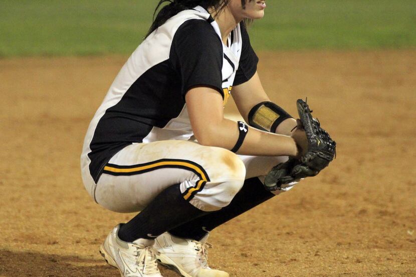 Forney shortstop Brooke McCarroll (6) takes a breather during a break in the action during...