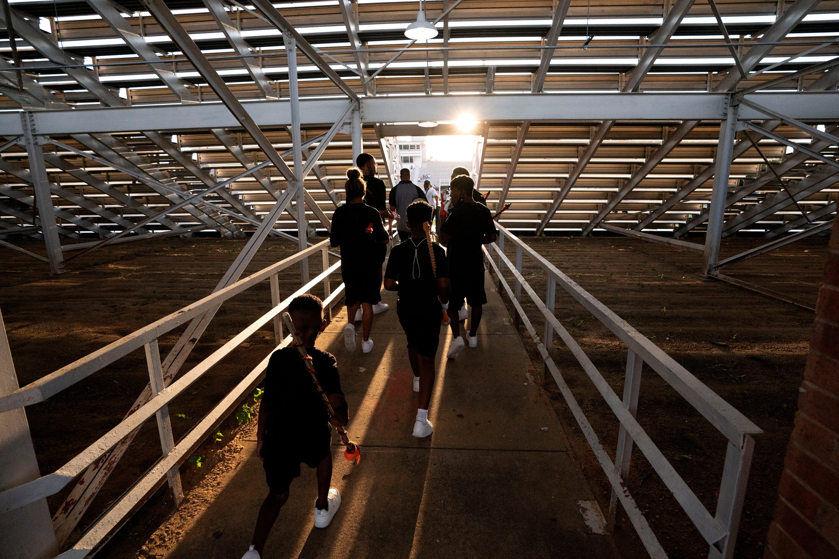 Lancaster drum majors lead the band into the stadium before a high school football game...