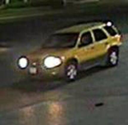 The robbers fled in a yellow Ford Escape. (Dallas Police Department)