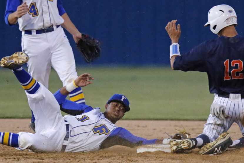 Frisco second baseman Everrett Harris (1) was too late to make the tag on Frisco Wakeland's...