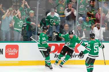 Dallas Stars center Joe Pavelski (center) celebrates his overtime goal with defenseman...