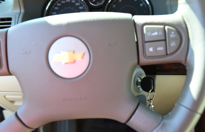 FILE - This April 1, 2014 file photo shows steering wheel and ignition switch on a 2005...