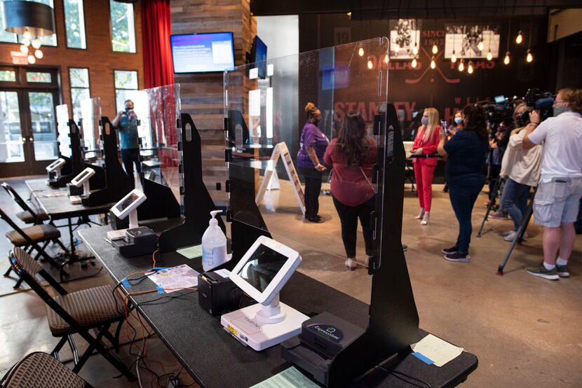 Voter check-in stations located inside a platinum level bar at the Dallas County Elections...