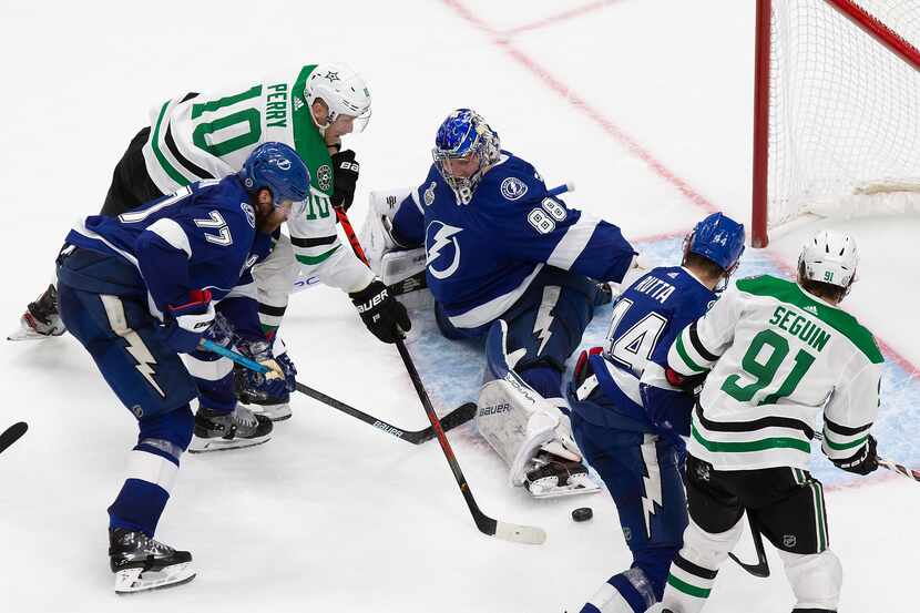 Corey Perry (10) of the Dallas Stars pokes the game winner past goaltender Andrei...