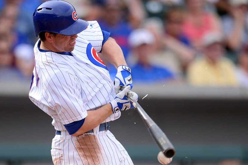 Mar 20, 2014; Mesa, AZ, USA; Chicago Cubs third baseman Donnie Murphy (8) swings the bat in...