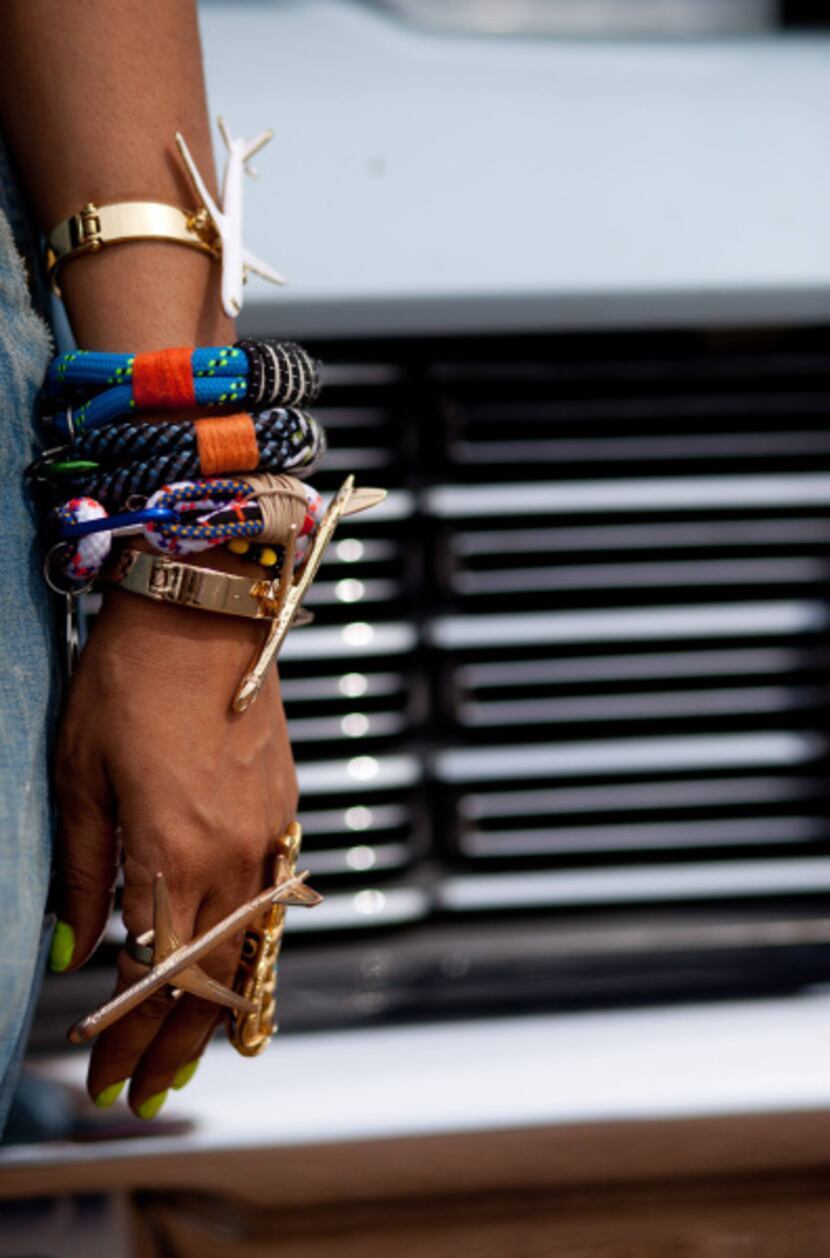 Badu's jewelry includes "I'm Fly" bracelets and ring crafted by friend and designer Melody...