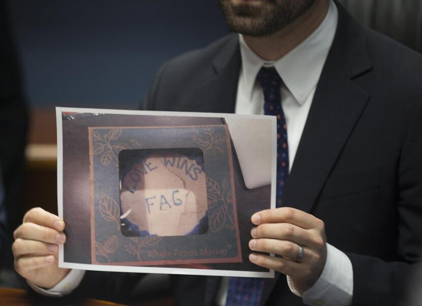 
Attorney Austin Kaplan holds a picture of a cake Pastor Jordan Brown claimed was made by...