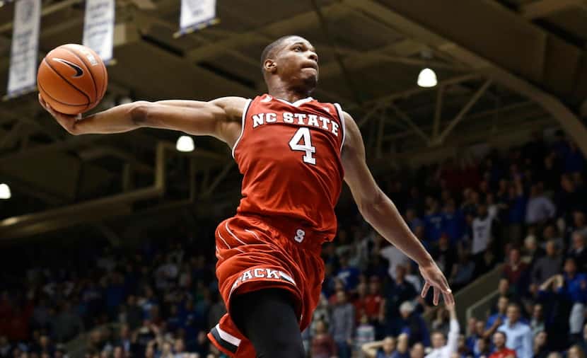 FILE - In this Jan. 23, 2017 file photo, North Carolina State's Dennis Smith Jr. (4) drives...