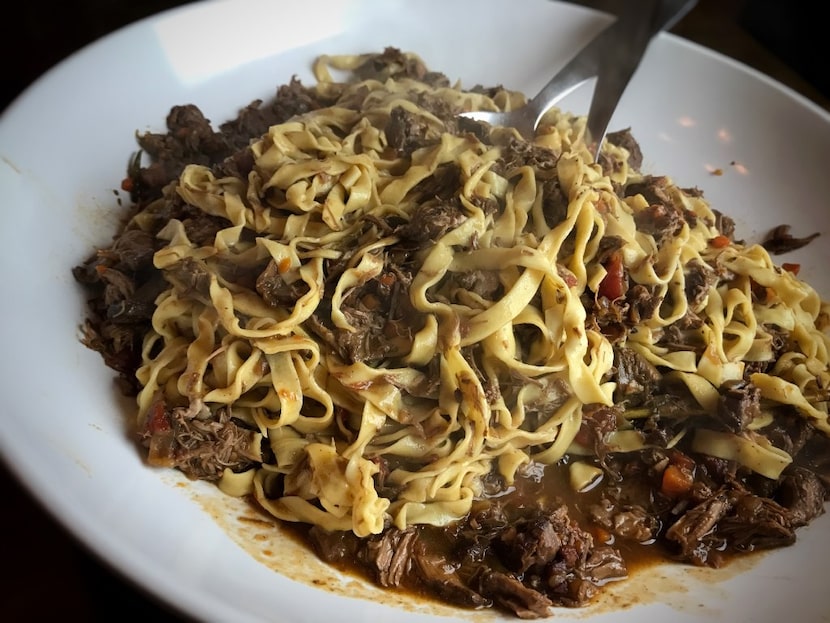 The fettuccine with lamb bolognese is ready to serve. Don't forget the Parmesan and crusty...