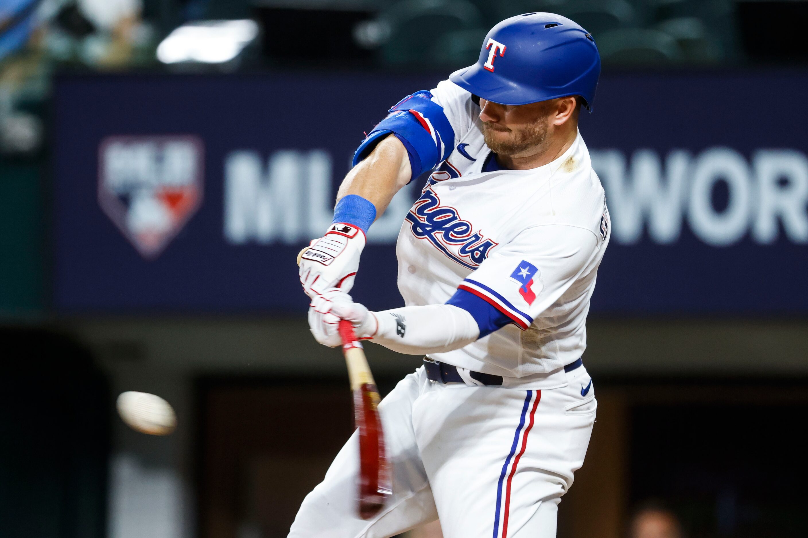 Texas Rangers left fielder Robbie Grossman flies out to Kansas City Royals left fielder...