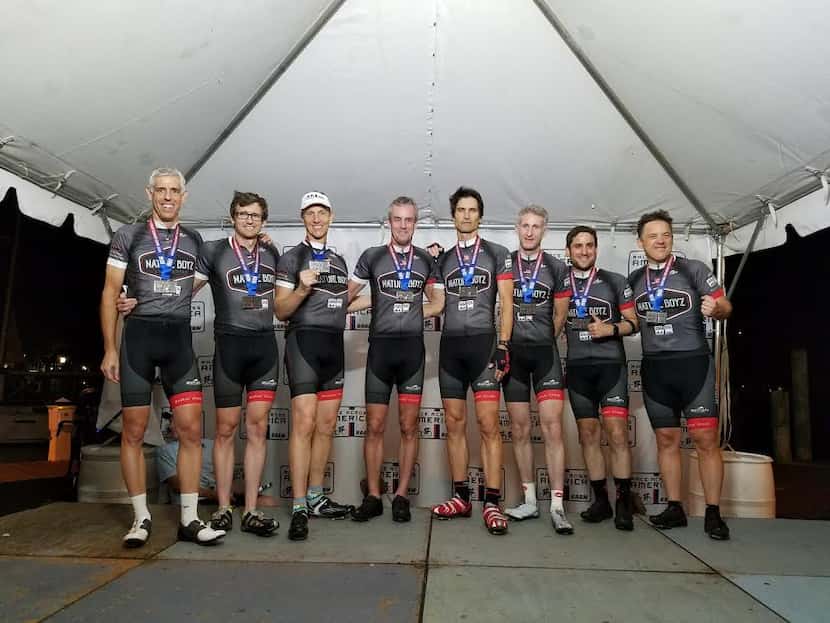 Craig Miller, far left, and his teammates pose for a photo after completing the 3,070-mile...