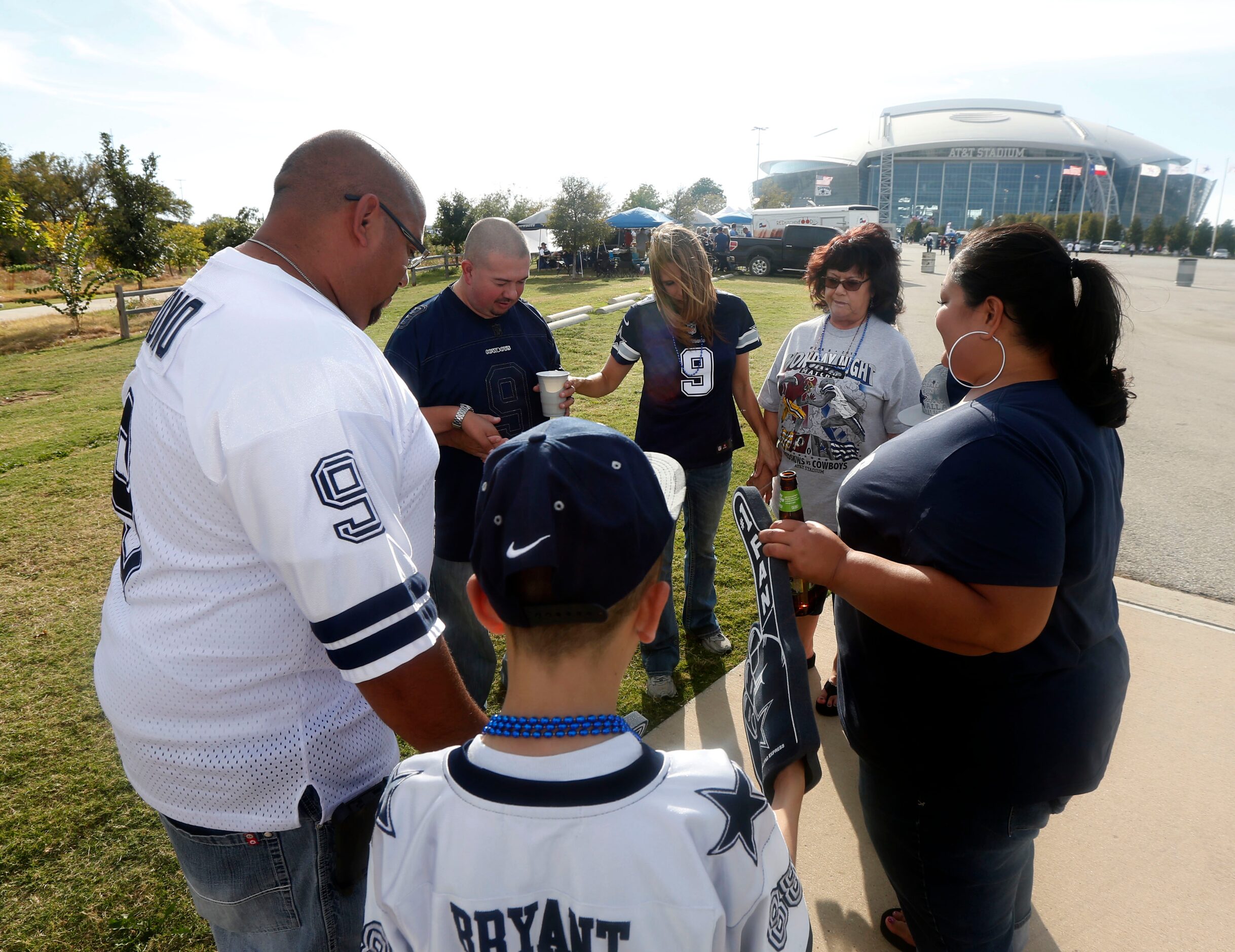 Jeremy and Cheri Montoya (wearing jersey 9) and Kathy Beevers (second from right)  of Four...