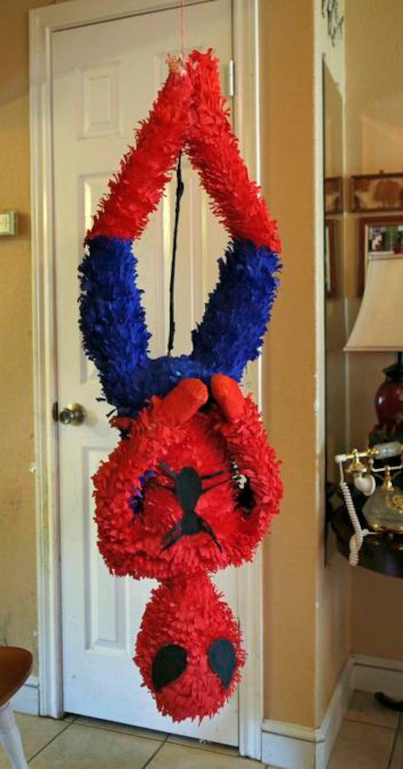 
A custom designed Spider-Man piñata hangs around Maria Barrera’s house, awaiting pick-up.
