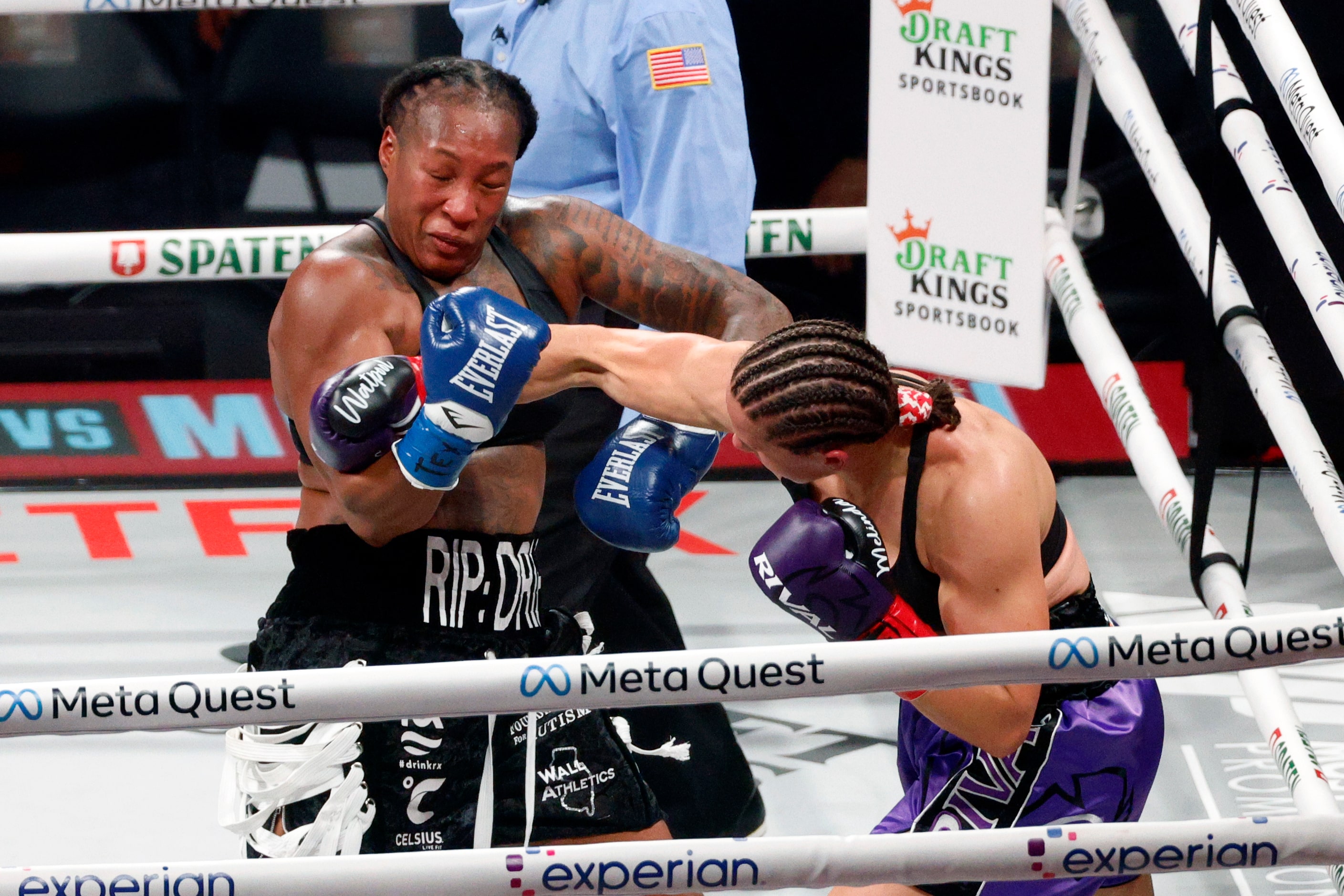 Melinda Watpool hits Shadasia Green with a punch during a super middleweight boxing match...