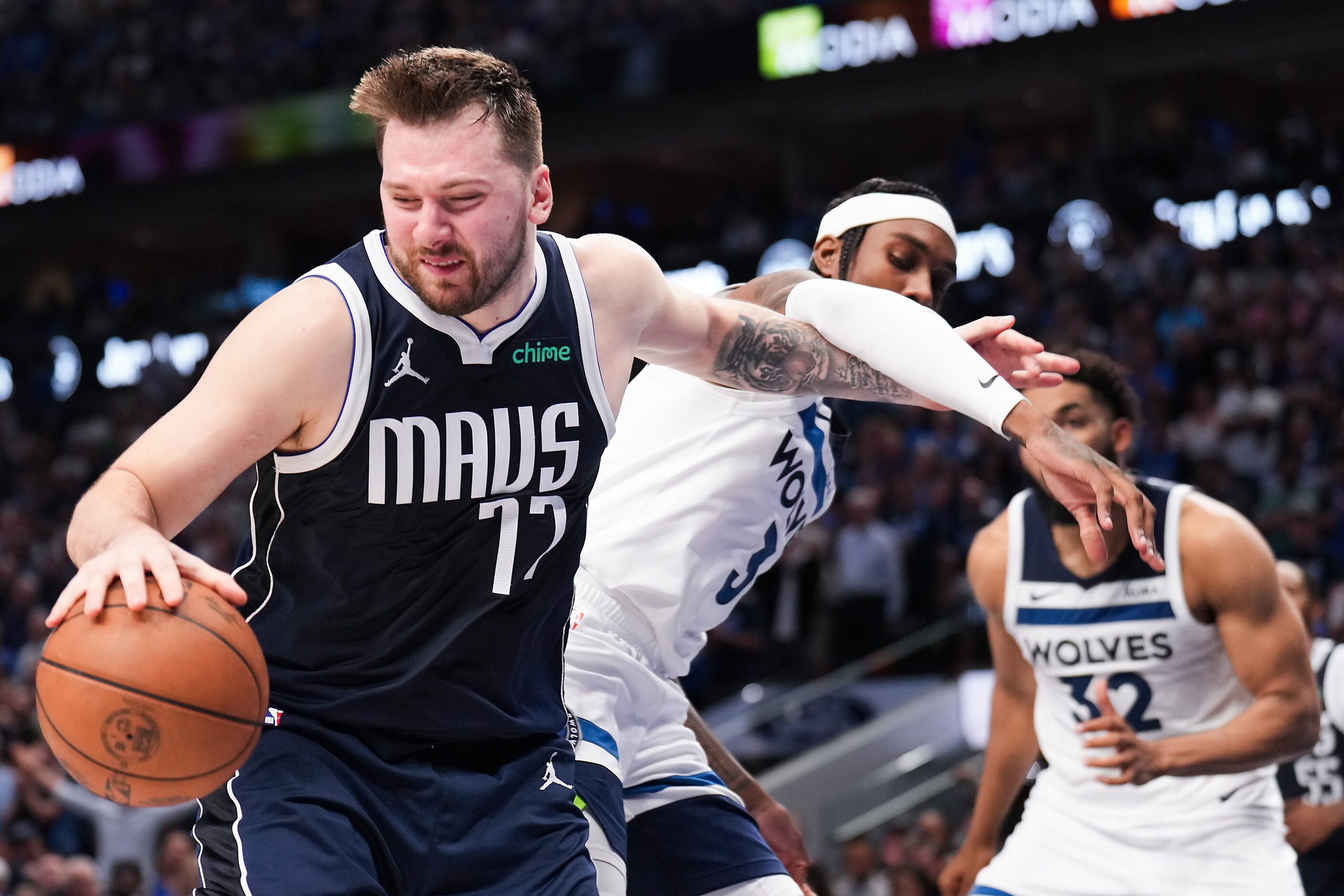 Dallas Mavericks guard Luka Doncic (77) grabs a rebound from Minnesota Timberwolves forward...