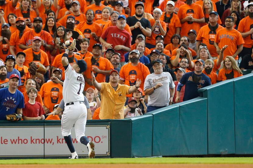 HOUSTON, TX - SEPTEMBER 27: Carlos Correa #1 of the Houston Astros catches a foul ball...