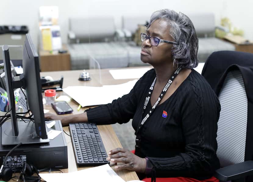 Hedy Watkins completes some work at her Richland College office in Dallas. Watkins is...