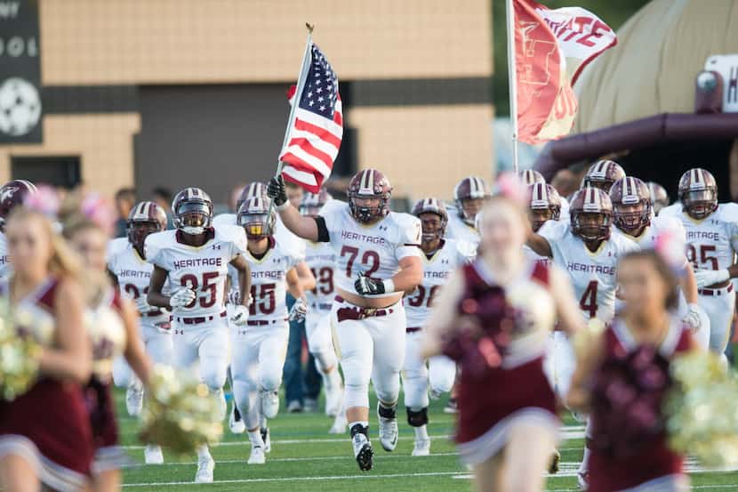 Frisco Heritage takes the field before a game against The Colony in 2015. (Cooper...