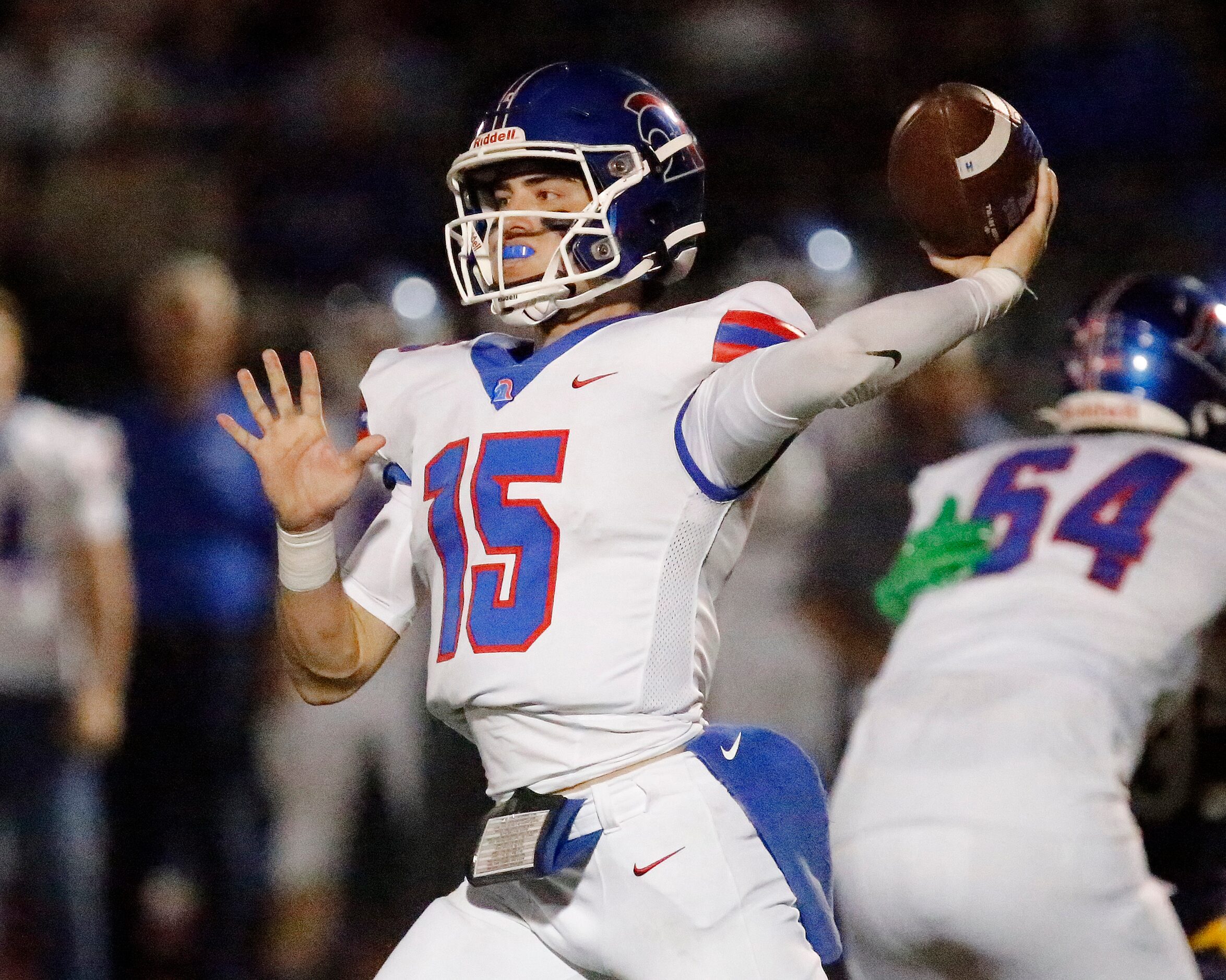 Trinity Christian Academy quarterback Aidan Mills (15) throws a pass during the first half...