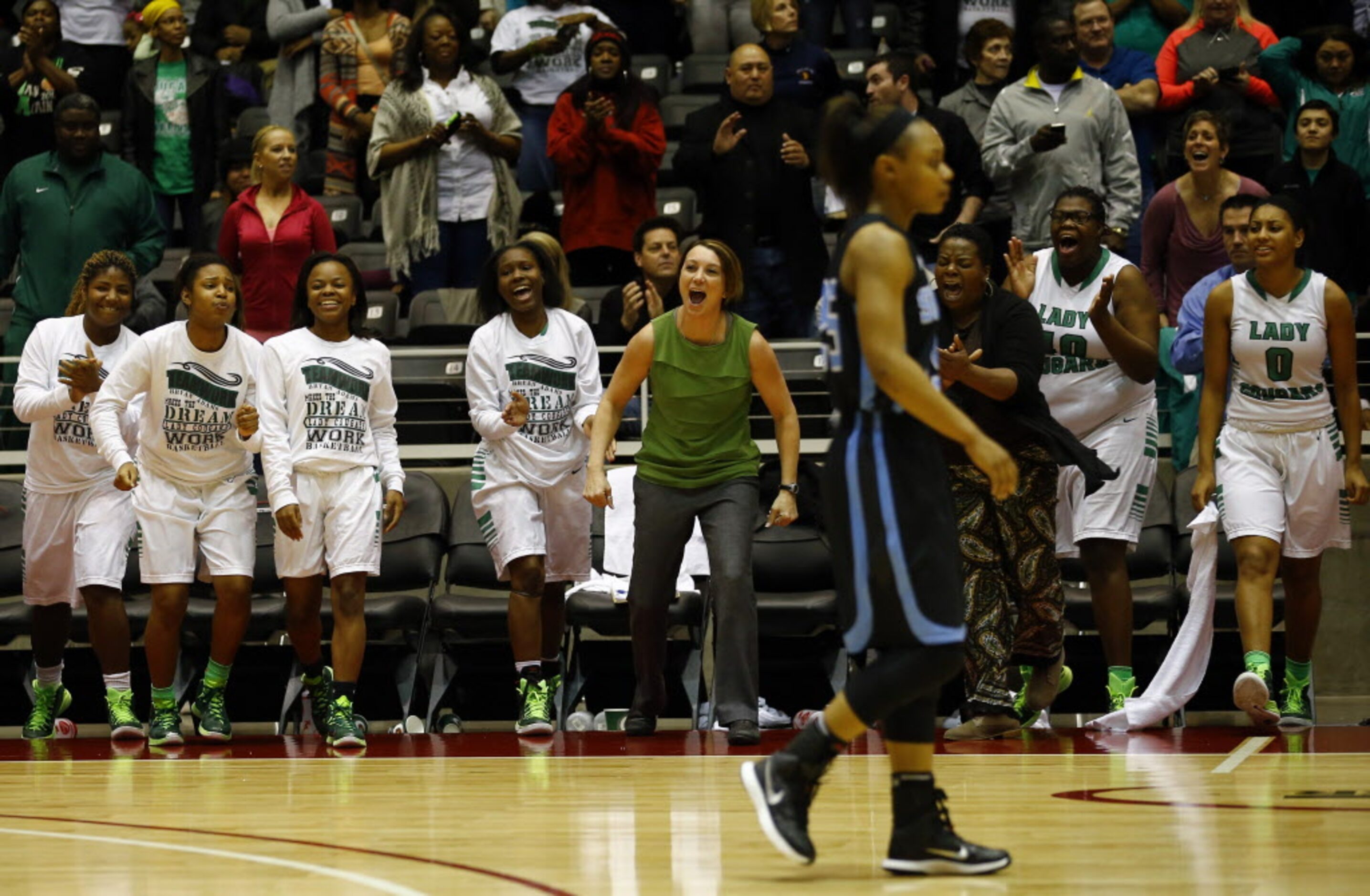 The Bryan Adams bench reacts during the Class 5A Region II girls basketball championship...